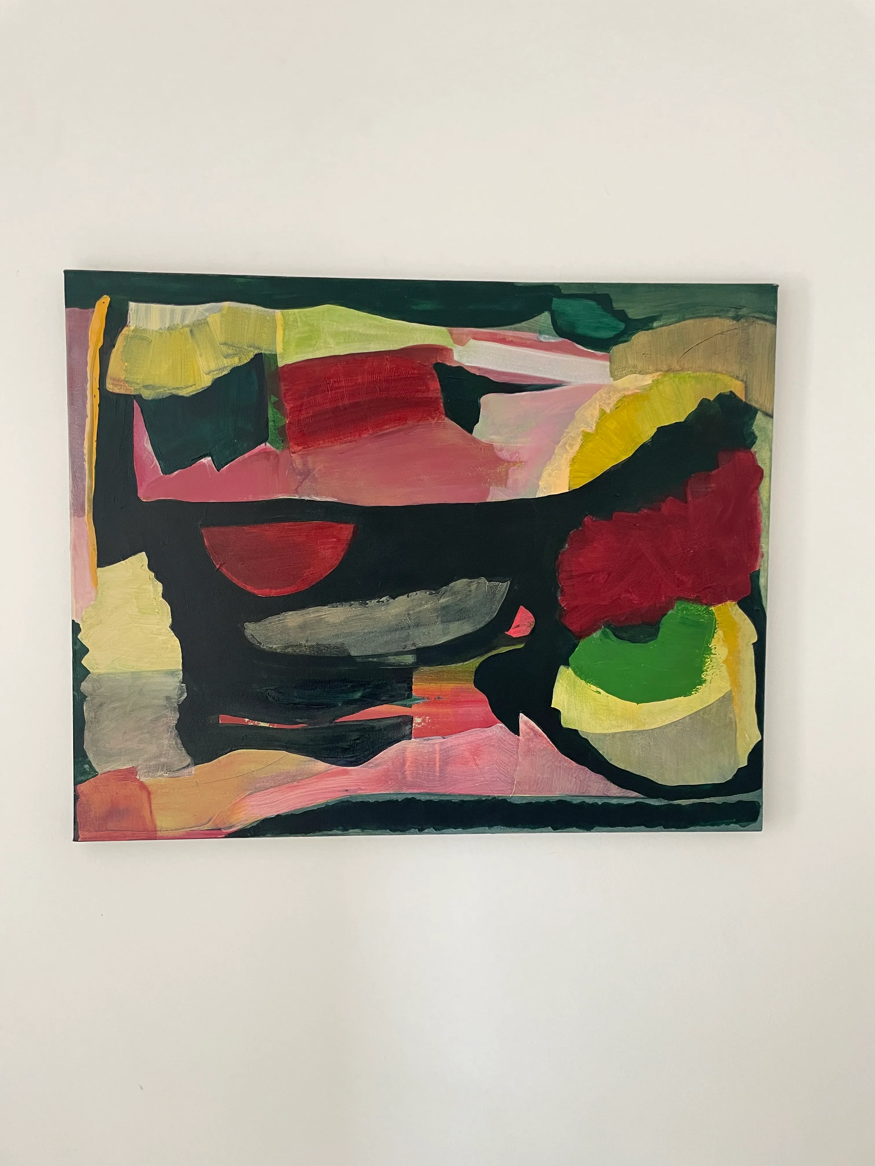 Abstract painting in reds, greens and yellow with dark central forms